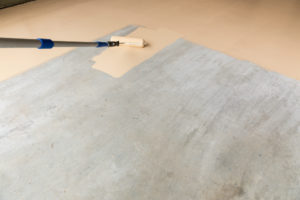 Epoxy Floor Paint being rolled onto a garage floor